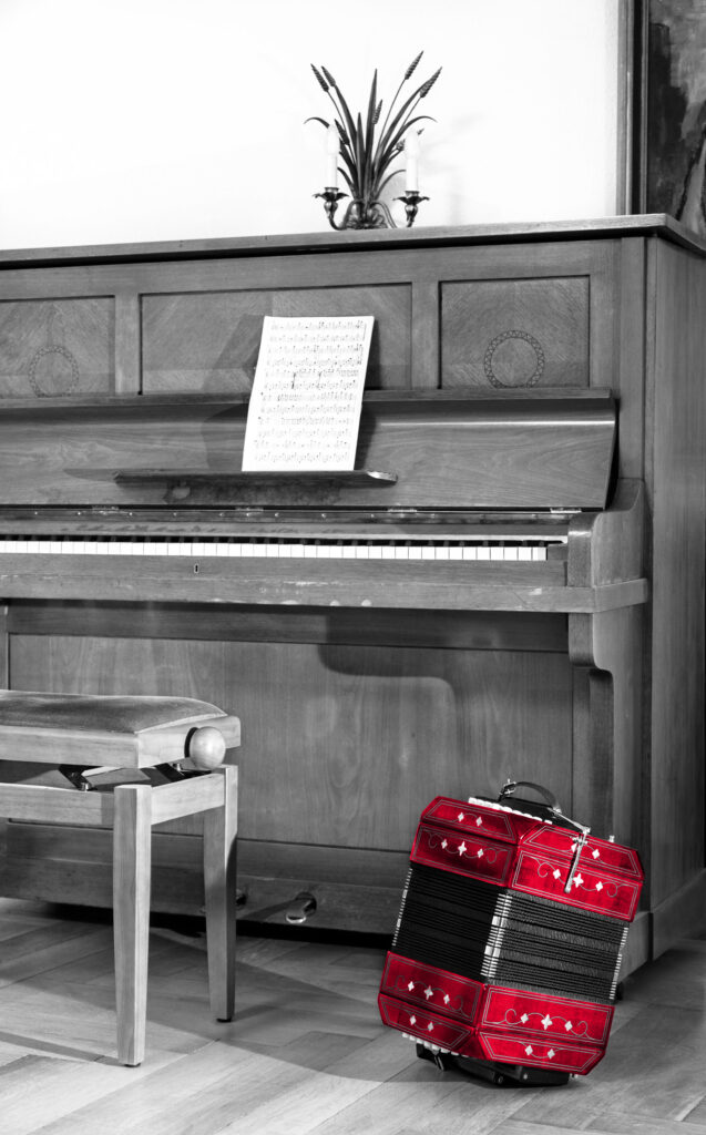 Old piano and bandoneon in musician